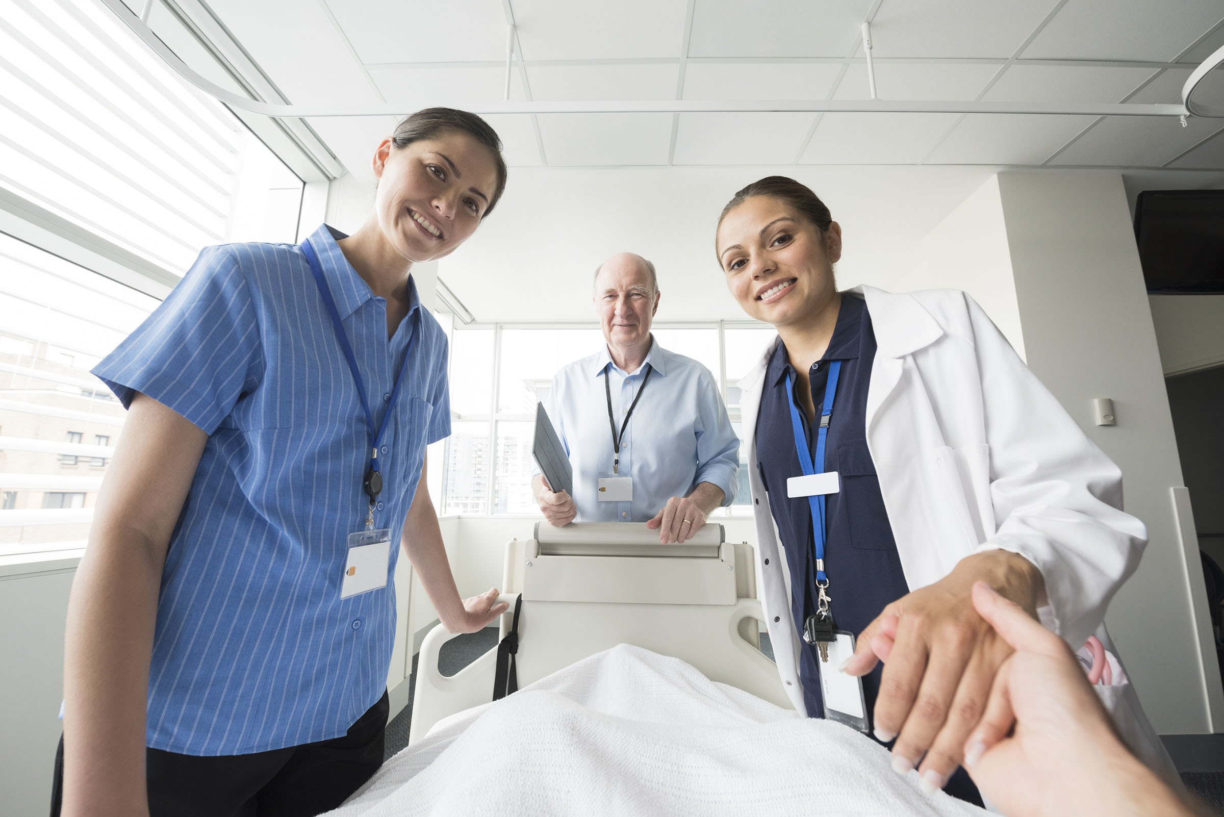 looking at medical team from hospital bed