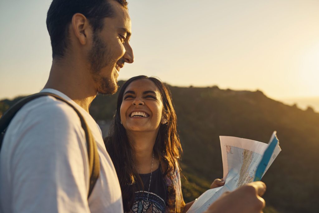 young couple with map