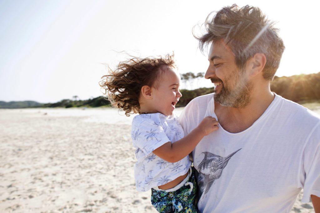 father and son at beach