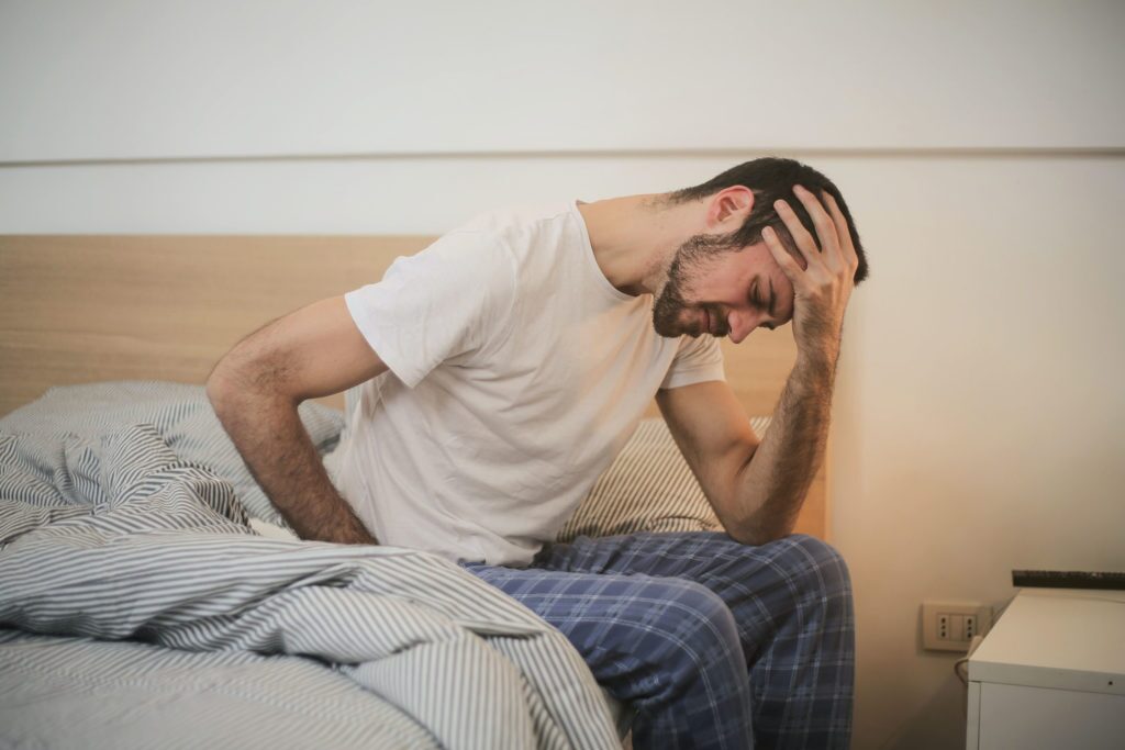 tired man on bed